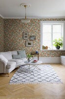 Bodri blommor och blad i grönt och orange